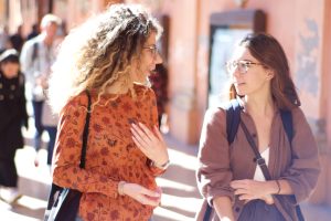 Two friends talking, telling a story